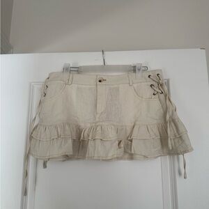 Edikted Cream Ruffled Mini Skirt with Lace-Up Sides